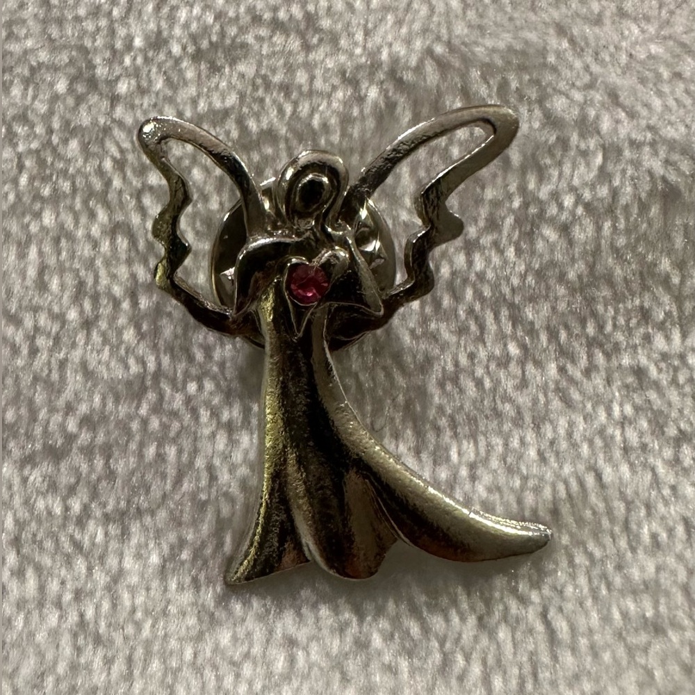 Camco silver angel pin with pink stone.